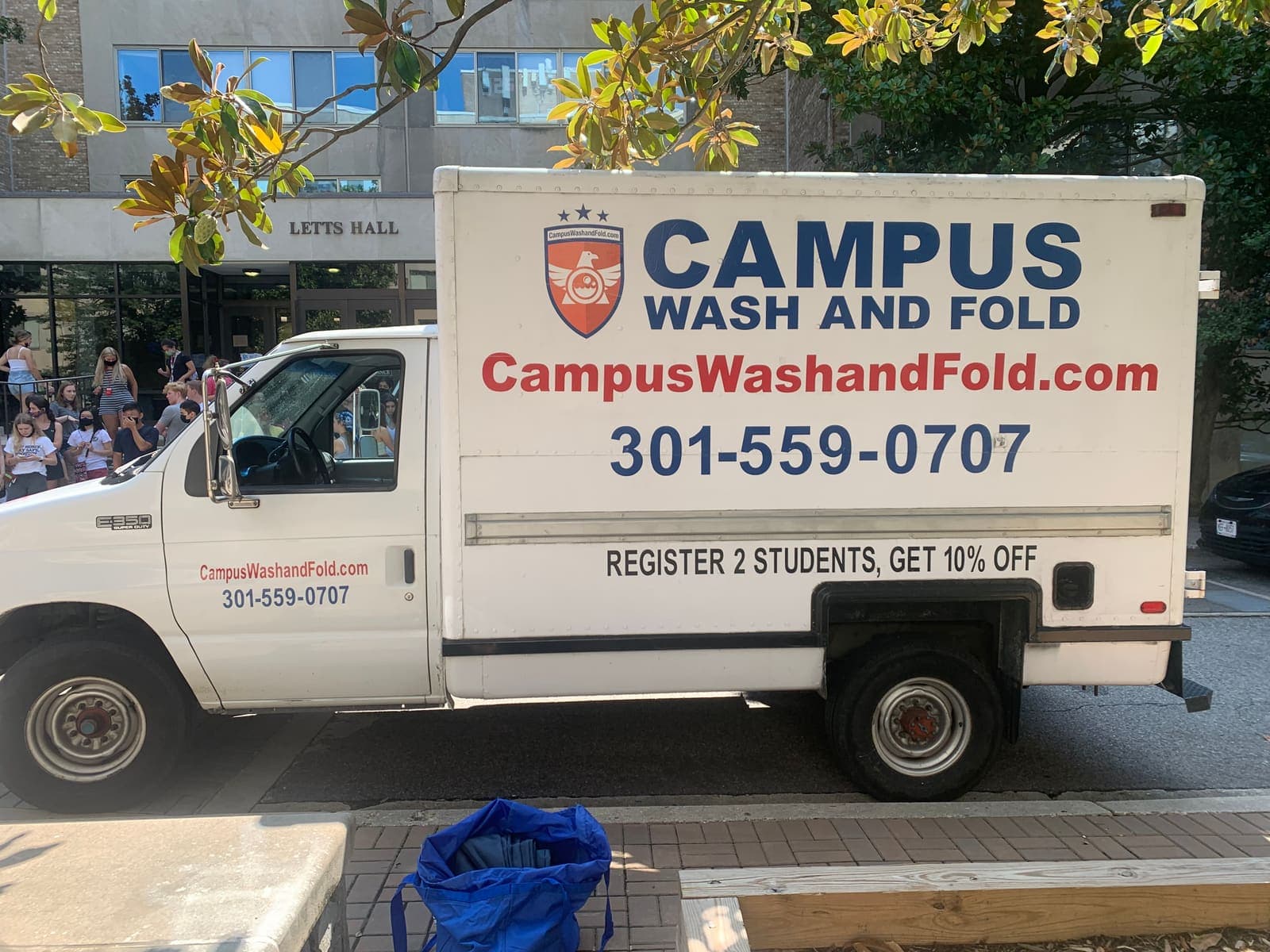 Campus Wash and Fold truck parked outside Letts Hall at American University in Tenleytown, Washington DC